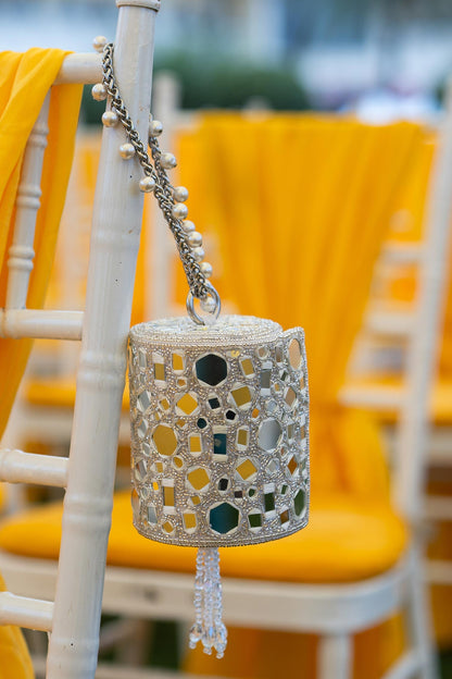 Rent Silver Mirror Work Cylindrical Bag