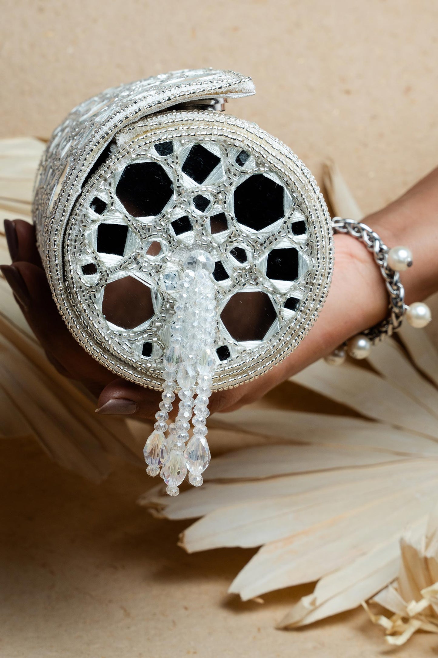 Rent Silver Mirror Work Cylindrical Bag