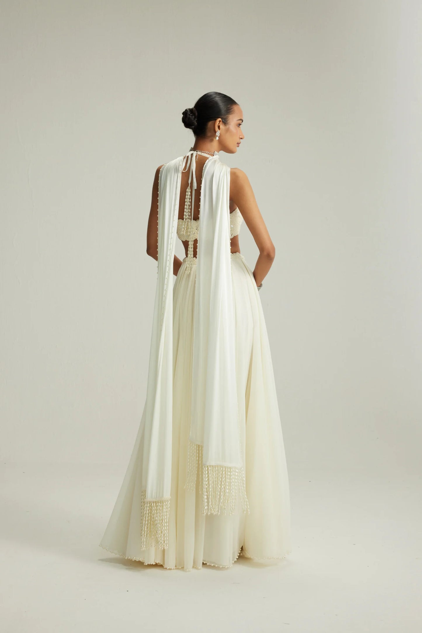 Rent Vani Vats Off White Skirt Set With Halter Neck Blouse
