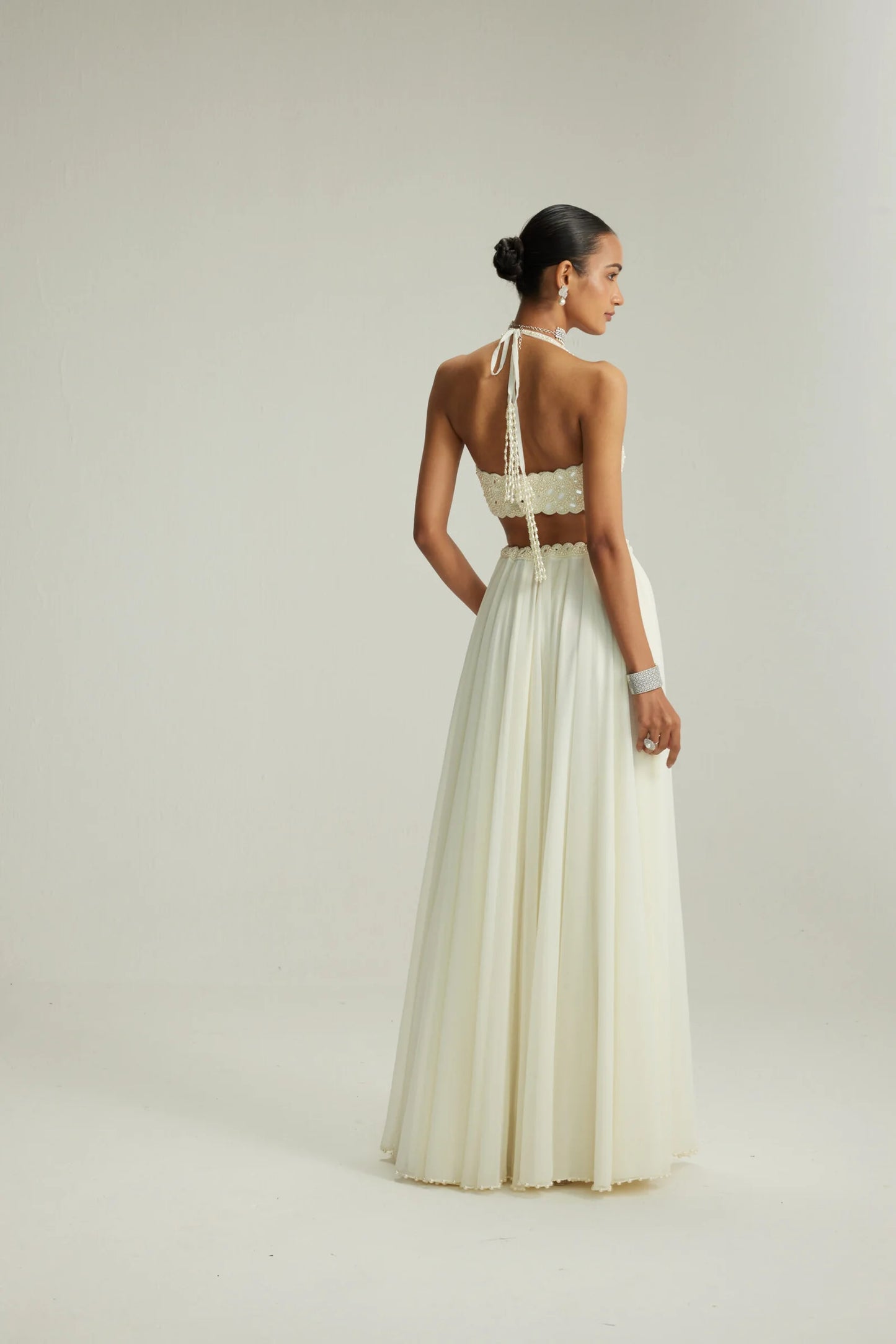 Rent Vani Vats Off White Skirt Set With Halter Neck Blouse