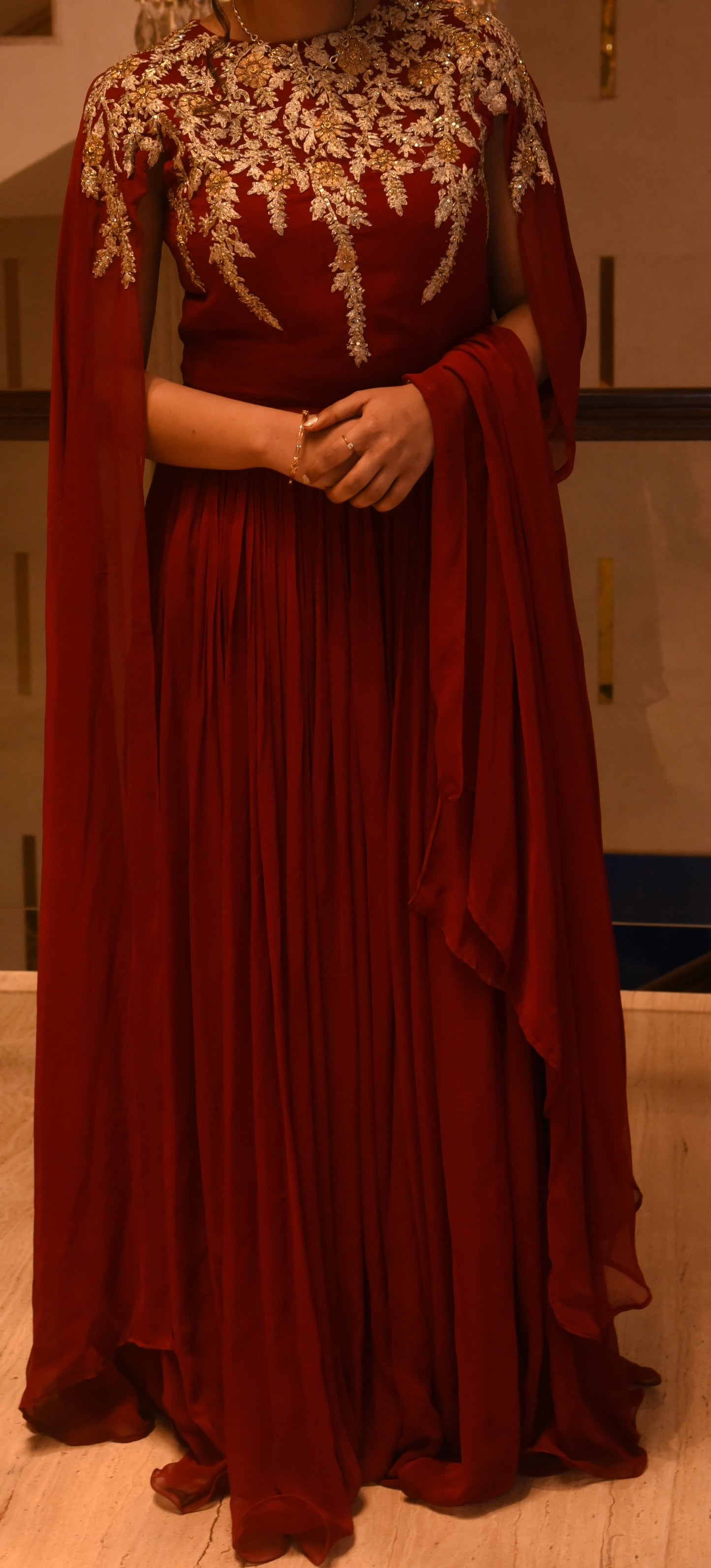 Red Gown with gold detailing on the neck