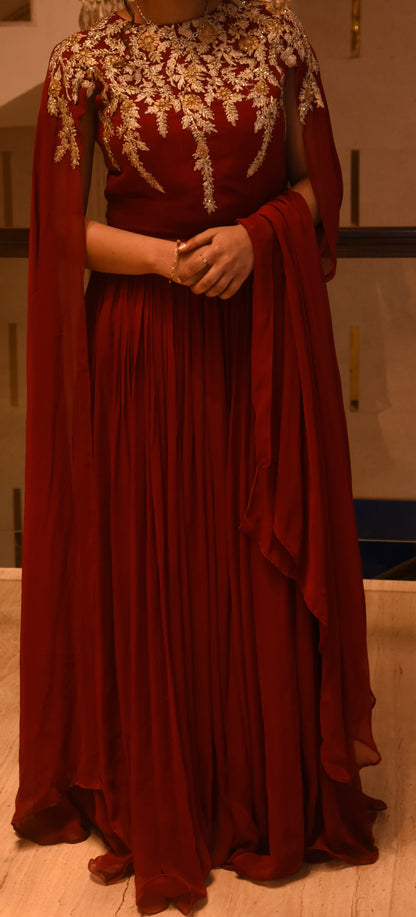 Red Gown with gold detailing on the neck